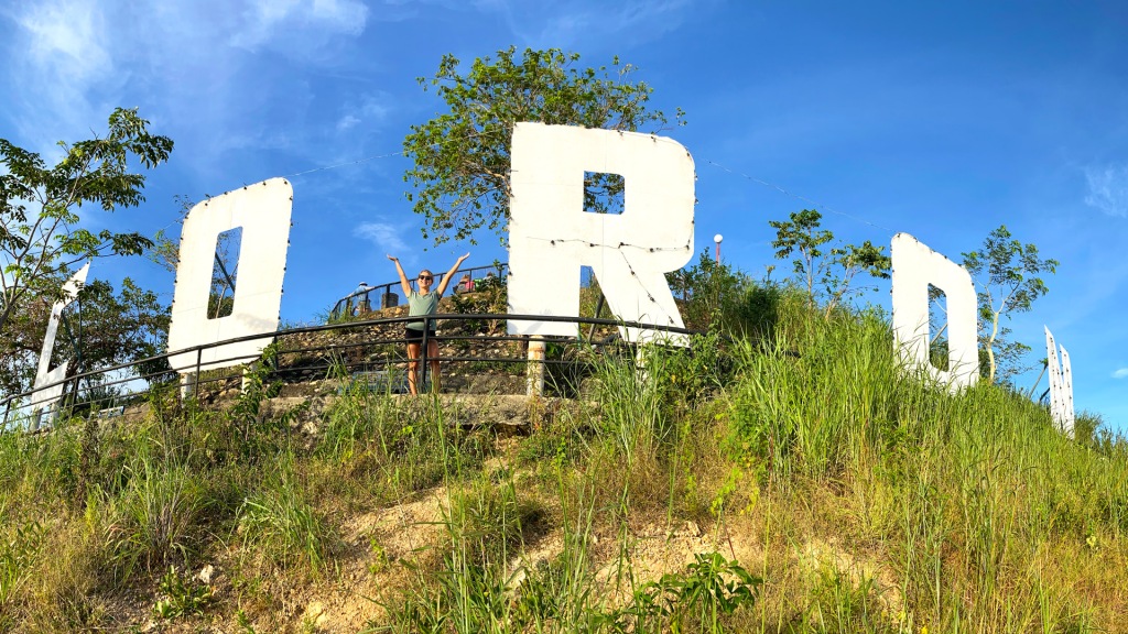 A large white sign reading "Coron" in the Philippines.