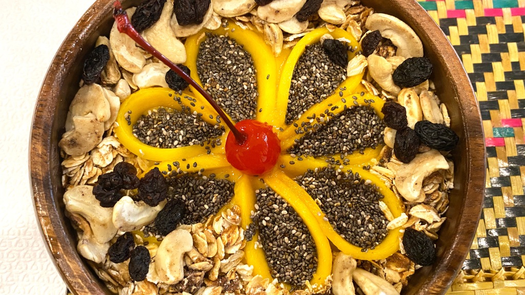 A smoothie bowl with the fruit in the shape of a flower.